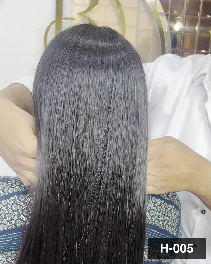 Long dark hair brushed smooth and held out to show the length at Salon By Babita, Haldwani — reference H-005