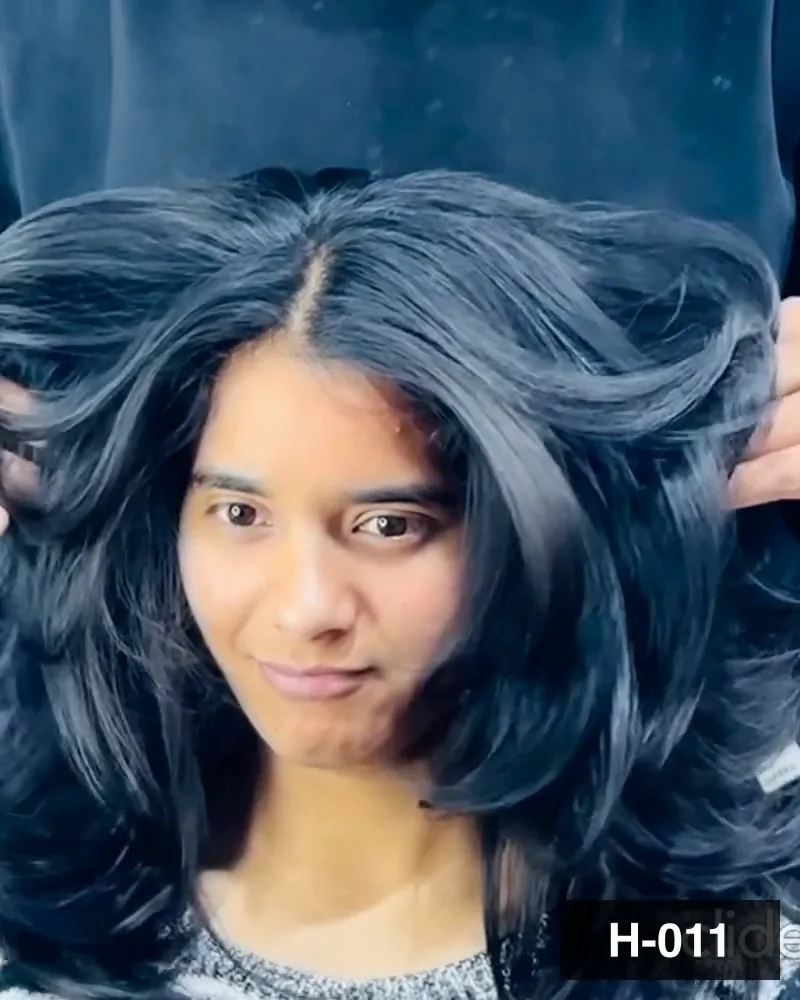 Mid-length hair blow-dried out to volume, the guest facing the camera at Salon By Babita, Haldwani — reference H-011