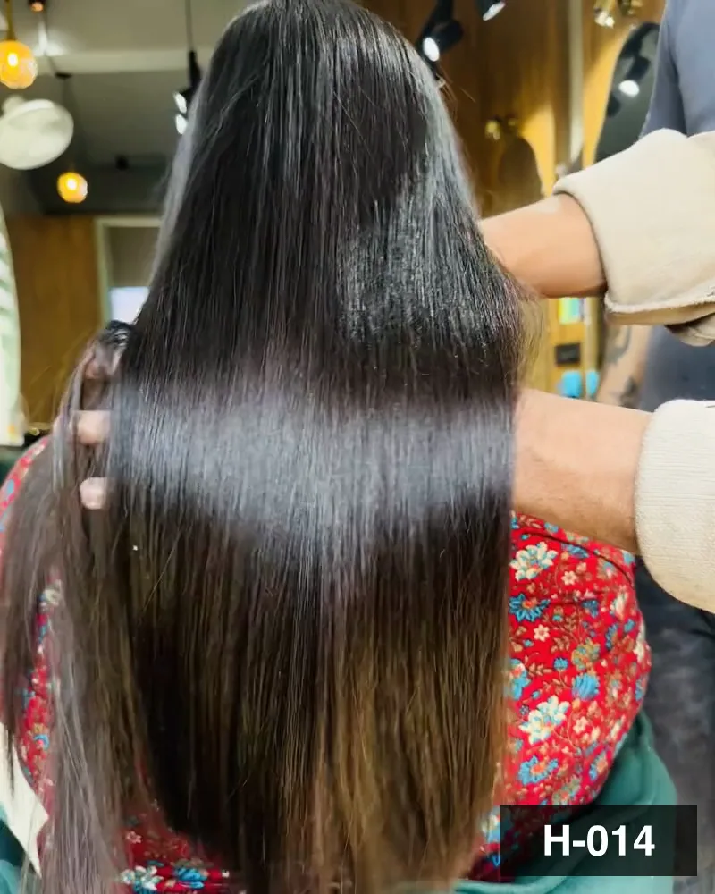 A close view of a smoothed length held out through the hand, seen from behind at Salon By Babita, Haldwani — reference H-014