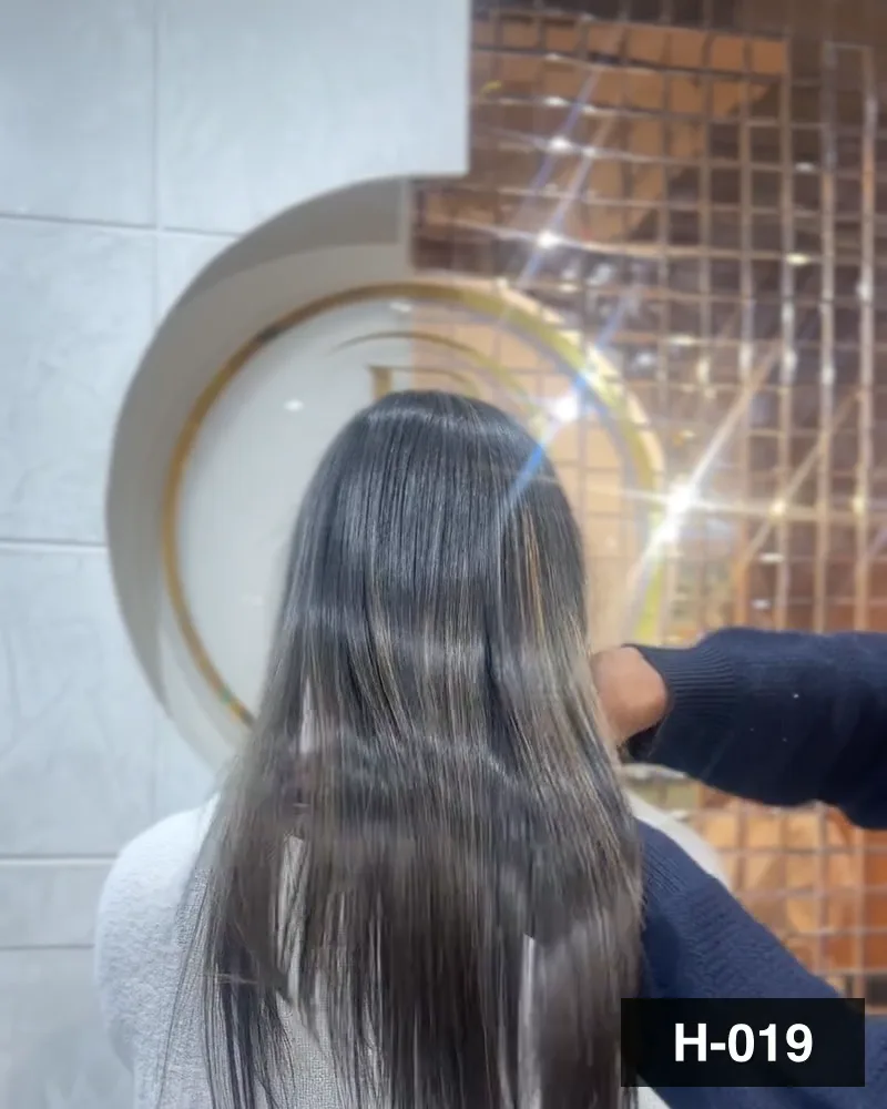Mid-length hair brushed straight and lifted at the ends, seen from behind at Salon By Babita, Haldwani — reference H-019
