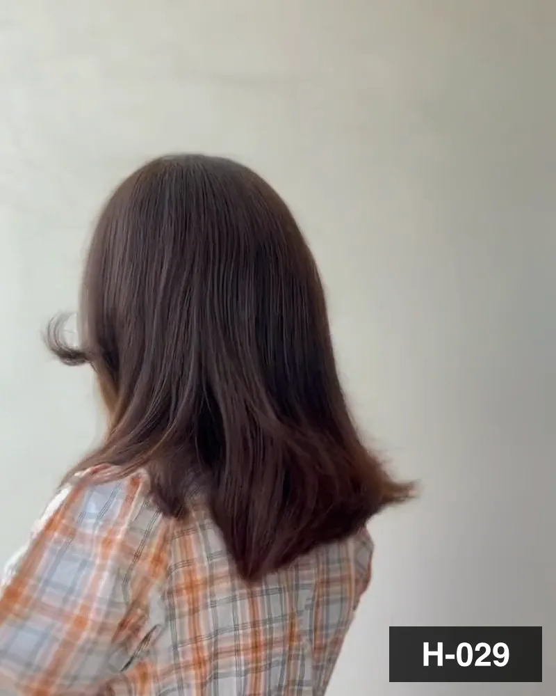 A guest turning to show a mid-length cut at Salon By Babita, Haldwani — reference H-029