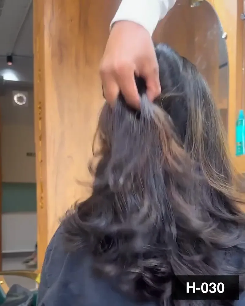 Mid-length hair blow-dried out to a bouncy finish, seen from behind at Salon By Babita, Haldwani — reference H-030