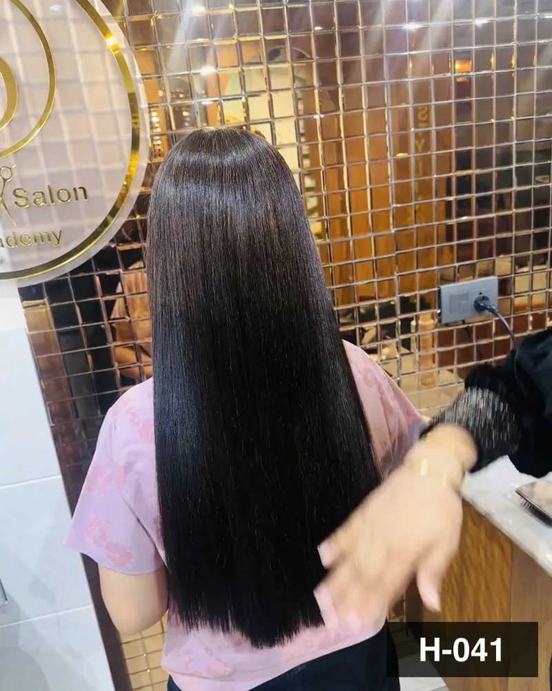Long dark hair combed straight at the mirror, seen from behind at Salon By Babita, Haldwani — reference H-041