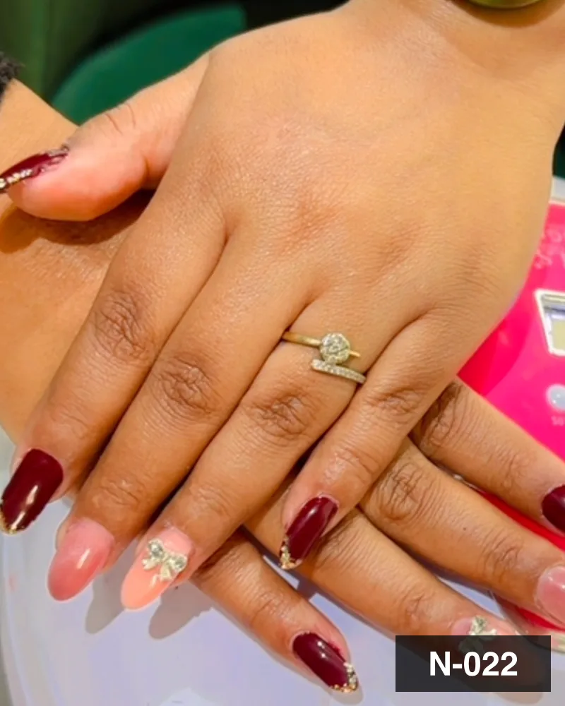A wine and nude two-tone set with gold detail, photographed at the salon at Salon By Babita, Haldwani — reference N-022