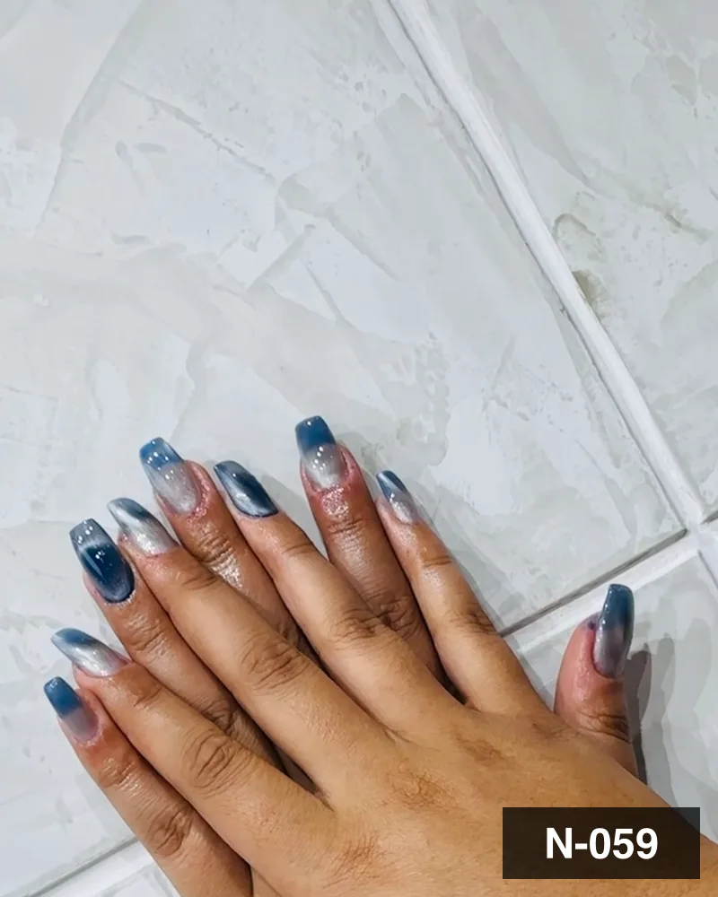 A blue marbled set with silver detail, both hands on the salon counter at Salon By Babita, Haldwani — reference N-059