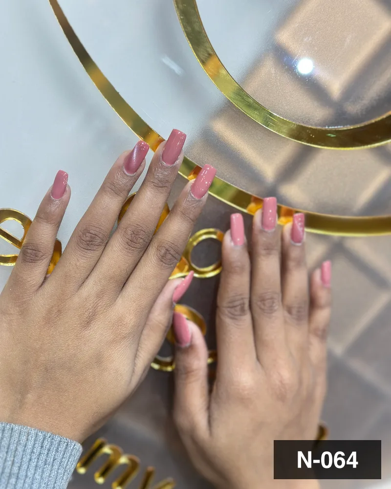 A mauve long square set, both hands laid on the salon's gold monogram at Salon By Babita, Haldwani — reference N-064