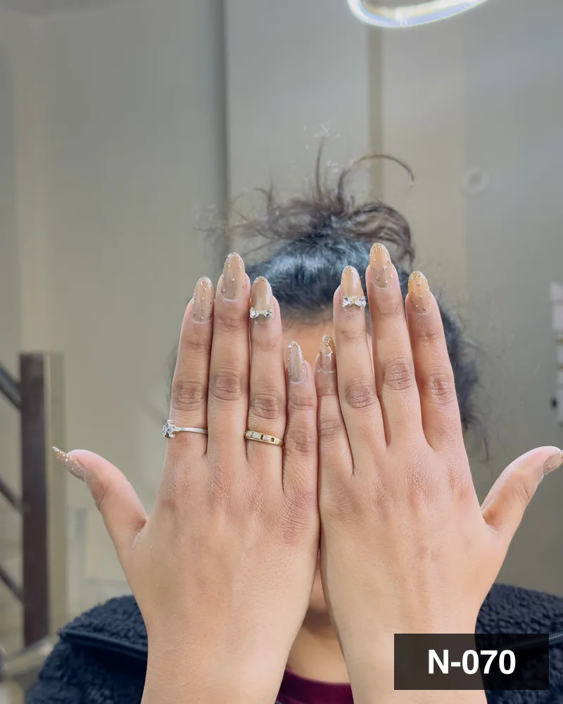 A silver glitter ombré long almond set, both hands raised together at Salon By Babita, Haldwani — reference N-070
