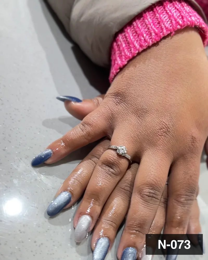 A grey and silver ombré almond set, both hands on the salon counter at Salon By Babita, Haldwani — reference N-073