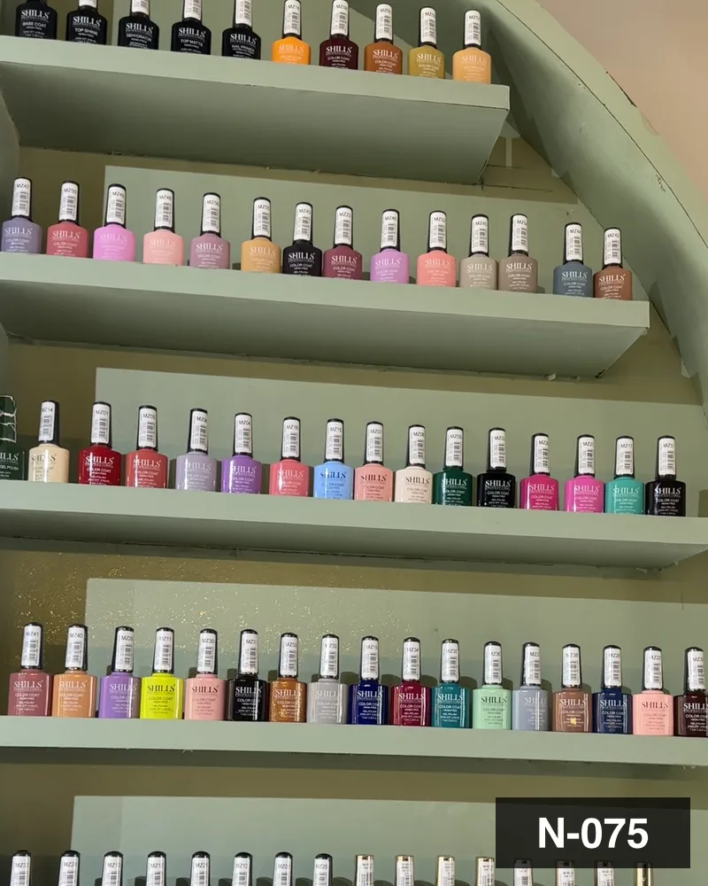 The salon's own gel polish wall, shelf by shelf at Salon By Babita, Haldwani — reference N-075