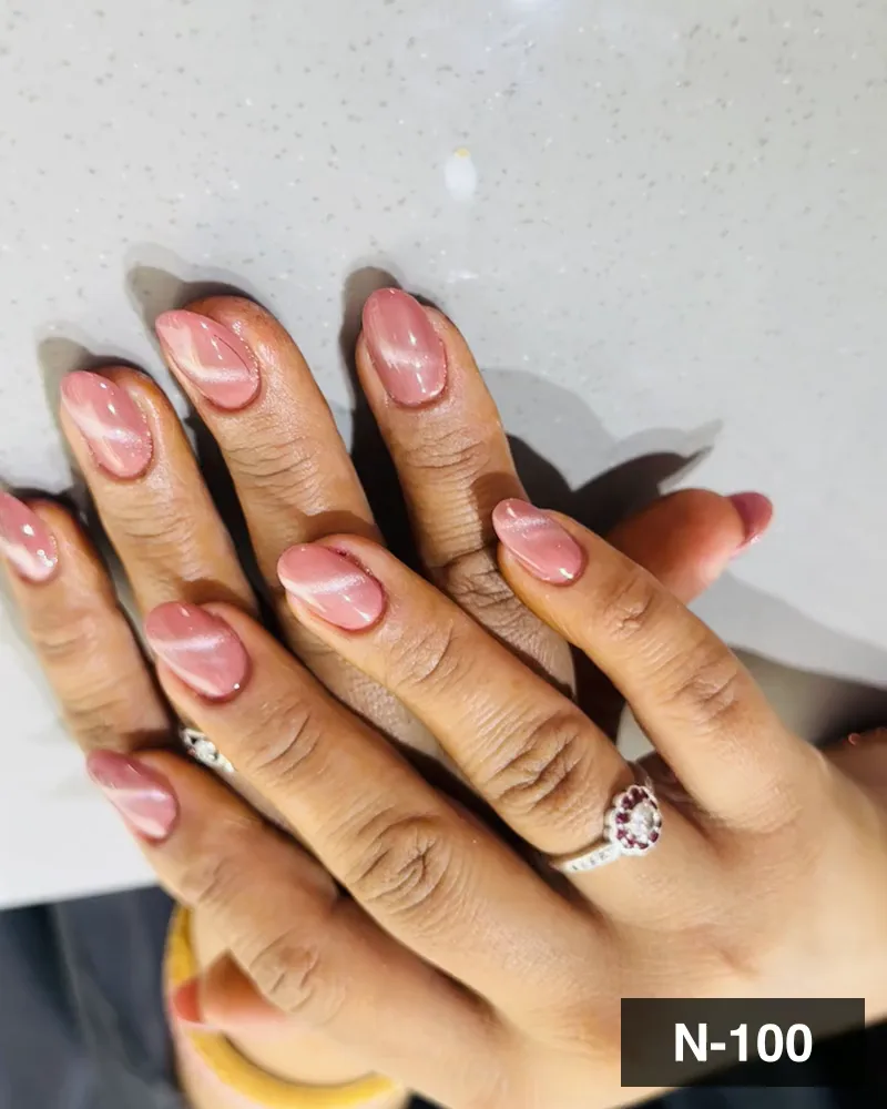 A blush marble nail set with a white swirl running through it on both hands at Salon By Babita, Haldwani — reference N-100