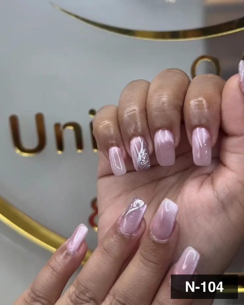 A pink chrome long square nail set with a silver glitter swirl accent on both hands at Salon By Babita, Haldwani — reference N-104