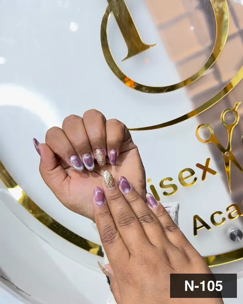 A lilac cat-eye nail set with one gold glitter accent nail on one hand at Salon By Babita, Haldwani — reference N-105