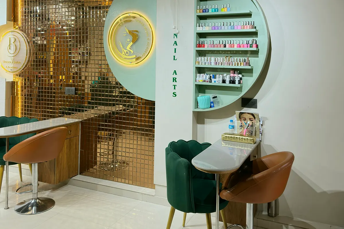 Nail studio with polish display wall and manicure tables at Salon By Babita, Haldwani