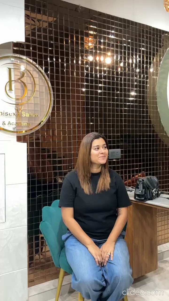 A client filmed at Salon By Babita, Haldwani, speaking about their visit — reference T-014